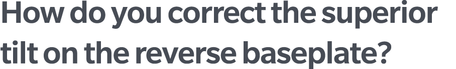 How do you correct the superior tilt on the reverse baseplate?